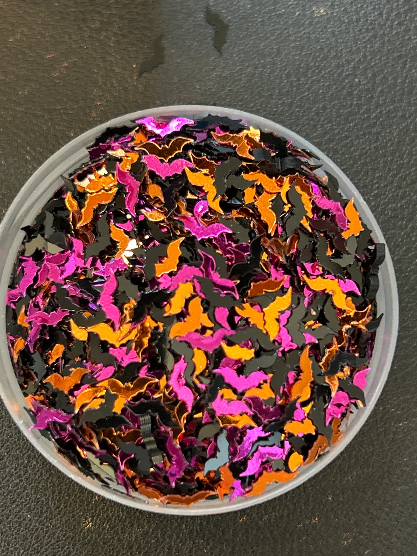 Black , purple & orange bats