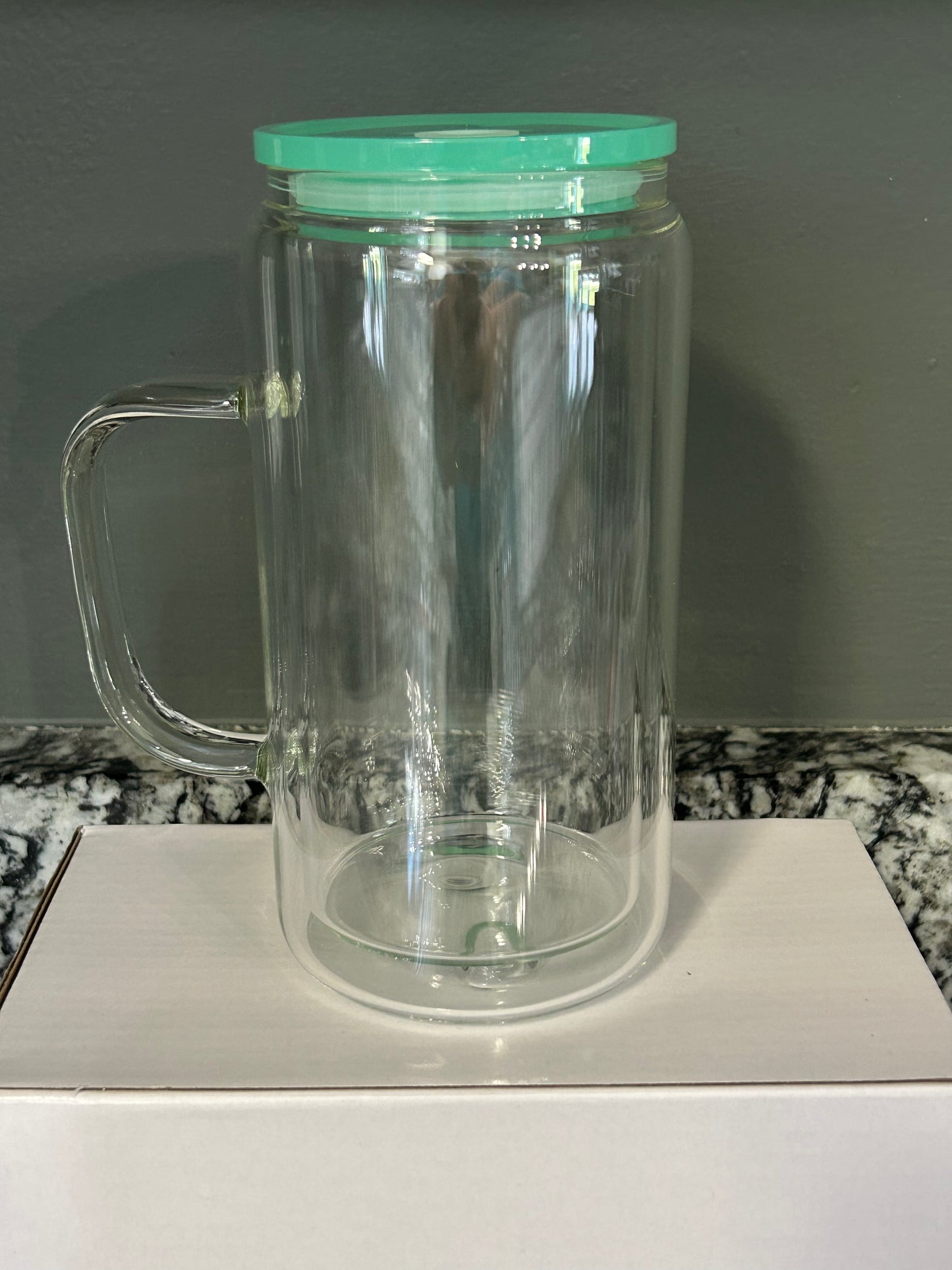 16 oz glass with handle. Colored lids and colored straws